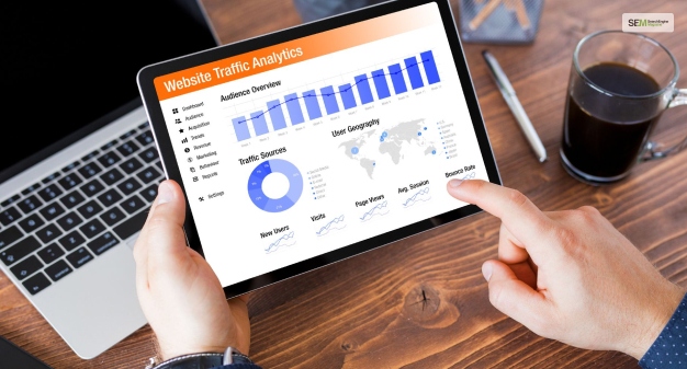 What does assigning a value to a google analytics goal enable?